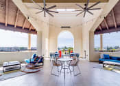 Thumbnail 18 of 33 - a large patio with chairs and tables and a view