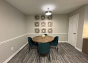 Thumbnail 29 of 29 - Twin Oaks Apartments in Hattiesburg Mississippi A dining room with a round table and chairs.