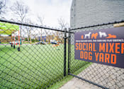 Thumbnail 42 of 51 - A sign for a Social Mixer at the Dog Yard.
