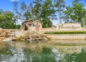 Thumbnail 21 of 24 - a stone retaining wall with a sign that reads fosters ridge and a water feature with a