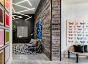 Thumbnail 14 of 20 - A room with a grey carpet and a wooden wall.