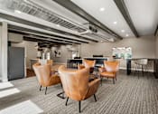 Thumbnail 35 of 42 - A conference room with brown leather chairs and a grey carpet.