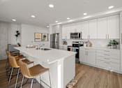 Thumbnail 1 of 43 - a large white kitchen with a white counter top