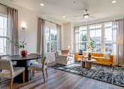 Thumbnail 7 of 13 - Luxury Atlanta, GA Homes – LaFrance Square – A modern dining room with a round table and chairs.
