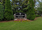 Thumbnail 25 of 25 - Lancaster Place Apartments entrance monument sign in Calera, Alabama with professionally landscaped grounds welcoming residents in Shelby County near Interstate 65.