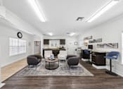Thumbnail 19 of 25 - Resident clubhouse lounge at Lancaster Place Apartments in Calera, Alabama with inviting seating and gathering areas for community events.