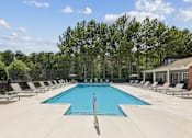Thumbnail 2 of 25 - Outdoor swimming pool with lounge chairs at Lancaster Place Apartments in Calera, AL offering a relaxing community amenity near Interstate 65.