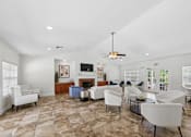 Thumbnail 21 of 25 - Resident clubhouse lounge at Lancaster Place Apartments in Calera, Alabama with inviting seating and gathering areas for community events.
