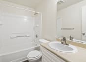 Thumbnail 23 of 30 - a bathroom with a sink toilet and shower