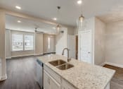 Thumbnail 3 of 16 - a kitchen with a sink and a counter top