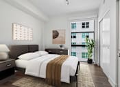 Thumbnail 7 of 30 - Spacious bedroom at MB Station apartments featuring large windows, modern finishes, and natural light near Brickell, Coral Gables, and Downtown Miami.