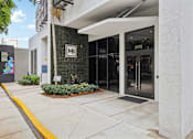 Thumbnail 28 of 30 - Welcoming entrance to MB Station apartments in Miami's Coral Way neighborhood with professional management and convenient access to nearby shopping, dining, and major employers.