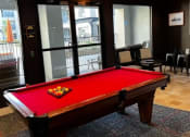 Thumbnail 20 of 22 - Apartments for Rent in North Little Rock, AR 72114– Metropolitan-   a red pool table in a room