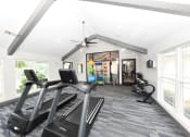 Thumbnail 3 of 27 - the preserve at ballantyne commons fitness room with cardio equipment and windows