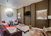 Thumbnail 16 of 22 - Pet-Friendly Rentals in North Little Rock, AR – Metropolitan – The club house with a large clock on the wall