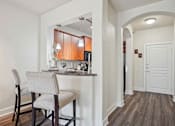 Thumbnail 8 of 22 - Pet-Friendly Rentals in North Little Rock, AR – Metropolitan – A kitchen with a table and chairs.
