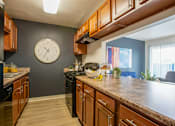 Thumbnail 6 of 37 - Tucson, AZ Apartments – Midtown on Seneca – Photo of Kitchen with cabinetry
