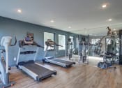 Thumbnail 3 of 13 - Fitness center with treadmills and weights at Mirador at Idlewood in Clarkston near Tyrone and East Atlanta