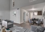 Thumbnail 5 of 13 - Bright living room with contemporary gray furnishings at Mirador at Idlewood near Edgewood and Clarkston, GA