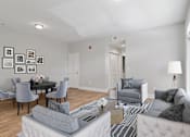 Thumbnail 7 of 24 - Living room with neutral finishes and updated flooring at Mirador at Peachtree Apartments.