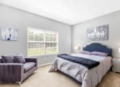 Thumbnail 5 of 16 - St. Ives Crossing apartments in Stockbridge Georgia photo of bedroom with large window