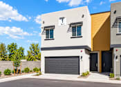 Thumbnail 23 of 25 - Exterior of a new two-story 3-bedroom townhome with private two-car garage at Villas at 91st in Tolleson, AZ