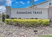 Thumbnail 4 of 36 - A sign that says "SIMMONS TRACE" in front of a building.