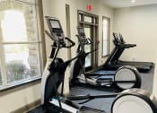 Thumbnail 18 of 27 - Villas at Hannover Apartments in Stockbridge, GA photo of fitness center with cardio equipment