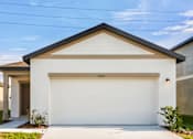 Thumbnail 5 of 75 - A white garage door with the number 34973 on it.