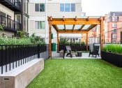 Thumbnail 14 of 36 - Open air courtyard with spacious dog park and pergola