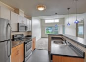 Thumbnail 12 of 28 - dining area with view to kitchen