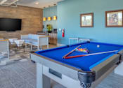 Thumbnail 4 of 25 - Clubhouse with billiards at pet-friendly apartments in Georgetown TX near downtown Georgetown