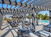 Thumbnail 14 of 25 - Outdoor pergola seating at Georgetown TX apartments near Wolf Ranch Town Center