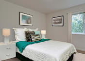 Thumbnail 3 of 17 - One Bedroom Apartments in Coeur D'Alene ID - Trail Lodge - Bedroom with Plush Carpeting and  Large Window