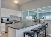 Thumbnail 9 of 17 - Coeur D'Alene ID Apartments for Rent - Trail Lodge - Spacious Clubhouse Kitchen with a Large Breakfast Bar
