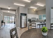 Thumbnail 1 of 17 - clubhouse kitchen and dining area