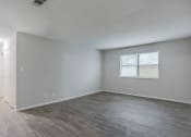 Thumbnail 4 of 13 - Macon, GA Apartment spacious bedroom with hardwood flooring