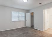 Thumbnail 8 of 13 - The element 4411, Macon, GA Apartment  spacious bedroom with hardwood flooring