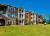 Thumbnail 20 of 24 - Pet-Friendly Apartments in Opelika, AL – The Crossings of Opelika - community building and grass area