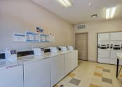 Thumbnail 4 of 20 - Beaumont, TX Apartments – Breakwater Bay - Laundry Facility with area for folding clothes