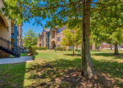 Thumbnail 19 of 24 - Outside view of Lake forest surrounded by nature and trees and grass