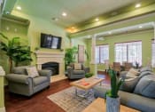 Thumbnail 7 of 24 - the clubhouse with a tv and area to relax on a couch or chair