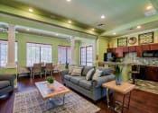 Thumbnail 8 of 24 - the clubhouse with a bar area and area to relax on a couch or chair