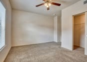 Thumbnail 9 of 25 - Bedroom with carpet, walk in closet, ceiling fan, and window with blinds