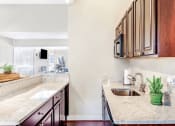 Thumbnail 21 of 40 - Grand Arbor Reserve apartments in Raleigh North Carolina photo of community kitchen