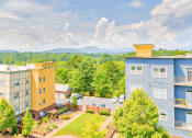 Thumbnail 20 of 23 - aerial view of the lofts at reynolds village apartment homes and mountain skyline