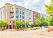 Thumbnail 18 of 23 - outdoor main road view of building with onsite retail shops