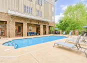 Thumbnail 15 of 23 - large resort style swimming pool with lounge chairs