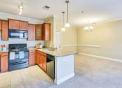 Thumbnail 7 of 23 - large dinning room with chandelier overlooking the kitchen