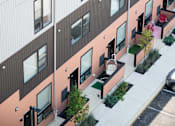 Thumbnail 37 of 78 - a view of the side of a building with windows and a courtyard